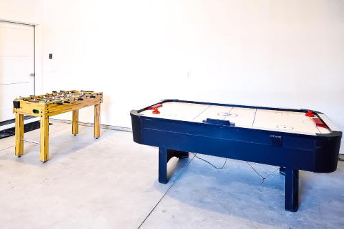 a ping pong table next to a pool table at Guest Favorite 3BD 2BA Meridian Home for Business & Pleasure in Meridian