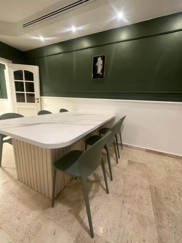 a meeting room with a large table and chairs at bedroom (3) apartment of 200 square meters with an outdoor terrace in Umm Uthainah