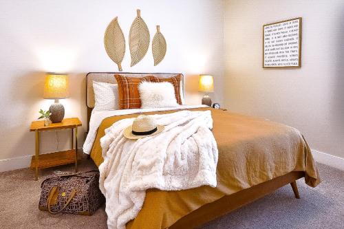 a bedroom with a bed with a hat on it at Guest Favorite 3BD 2BA Meridian Home for Business & Pleasure in Meridian