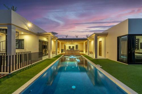 a swimming pool in the backyard of a house at Casa Herradura - Ocean View Luxury Villa in Cabo San Lucas