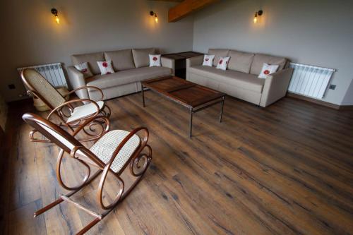 a living room with a couch and a table at La Creu de la Pinya in Berga