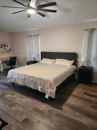 a bedroom with a bed with a ceiling fan at Casa in The Cove in Cape Coral