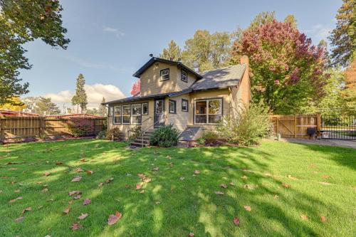a house with a yard with green grass at Cozy Grants Pass Home about 9 Mi to Rogue River Access in Grants Pass