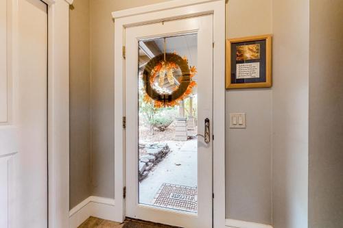a door in a hallway with a wreath on the wall at A1 at Castle Hill - Townhome in Cavendish
