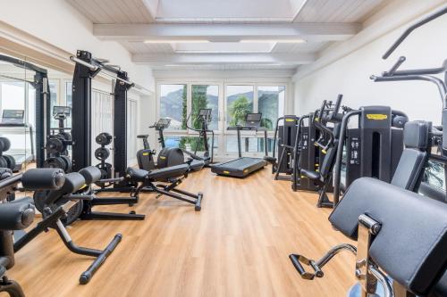 a gym with lots of treadmills and exercise bikes at Seehotel Pilatus in Hergiswil