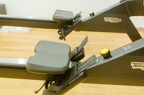 a desk with a chair in a gym at Accra Luxury Apartments @ The Signature in Accra