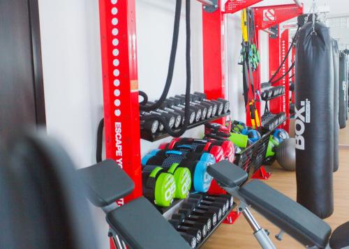 a gym with a rack of bikes and weights at Accra Luxury Apartments @ The Signature in Accra