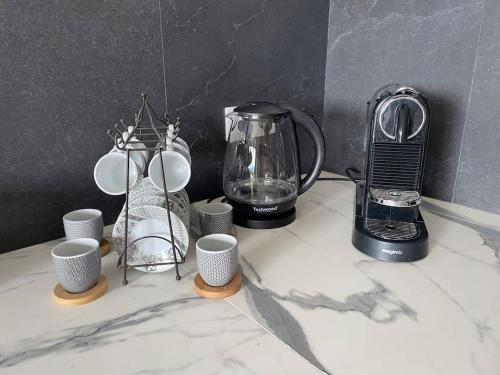 Tetera y cafetera en Charmante maison de vacances Sud France