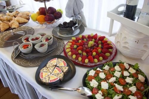 a table with many different types of food on it at B&B Il Parco in Monterosso al Mare