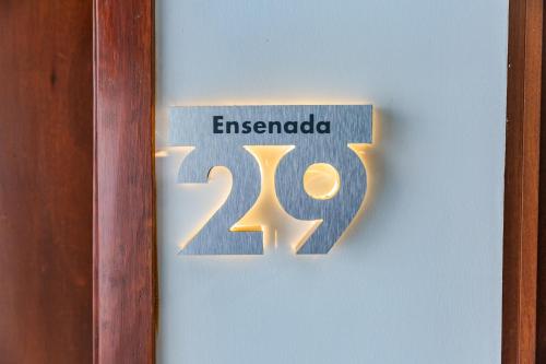 a sign on a door with the number at Casa Castillo in Mexico City