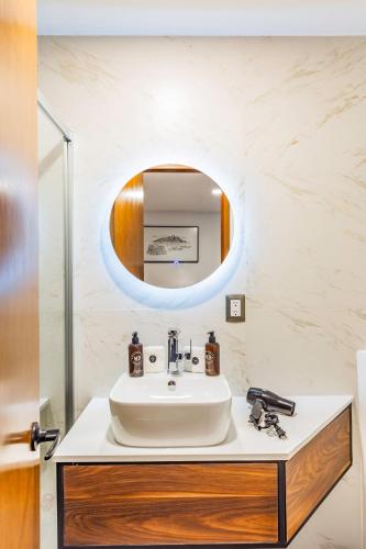 a bathroom with a sink and a mirror at Casa Castillo in Mexico City