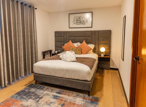 a bedroom with a large bed in a room at Casa Castillo in Mexico City