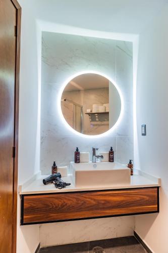 a bathroom with a sink and a mirror at Casa Castillo in Mexico City