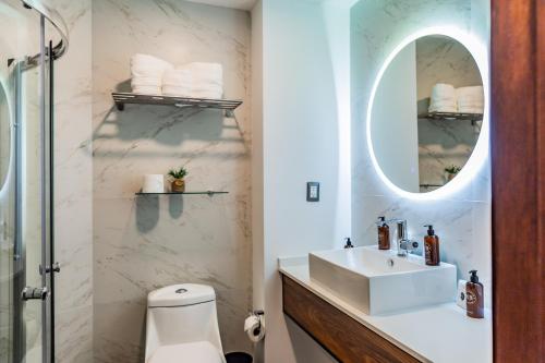a bathroom with a sink and a mirror at Casa Castillo in Mexico City