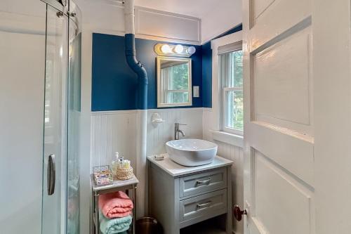 a bathroom with a sink and a mirror at Boothbay Blue in Boothbay Harbor