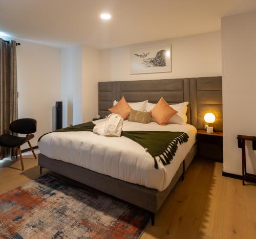 a bedroom with a large bed in a room at Casa Castillo in Mexico City