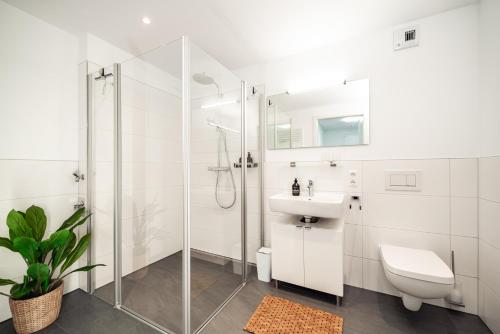 Ванная комната в NK Apartments - Hafencity Dresden mit Elbblick - Modern & Zentral