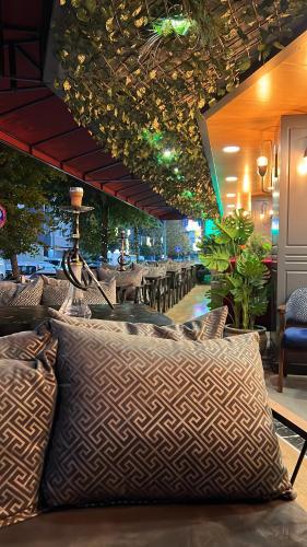 a restaurant with a couch with pillows on it at Viv City Hotel in Istanbul