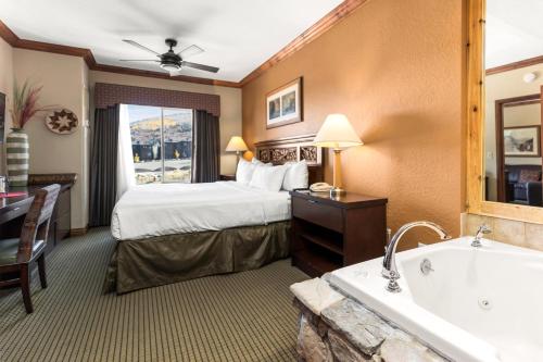 a hotel room with a bed and a bath tub at Canyons Westgate Resort #4506 in Park City