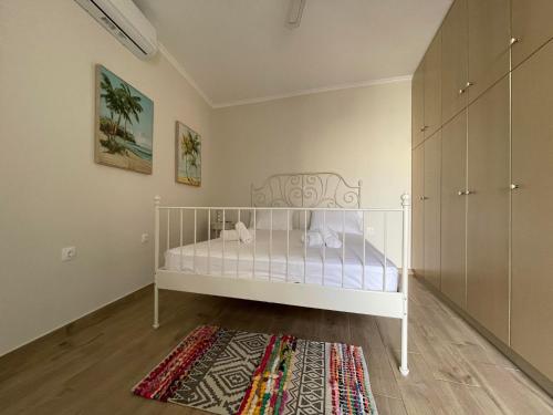 Postel nebo postele na pokoji v ubytování kalos house