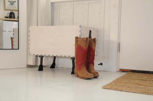 a pair of brown boots sitting next to a piano at Inn Santa Clara in Santa Clara