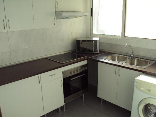 O bucătărie sau chicinetă la Ruzafa Apartments