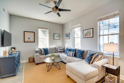 a living room with a couch and a ceiling fan at Cloud 9 on the Gulf, 1 Mi to Beach Pet Friendly in Bay Saint Louis
