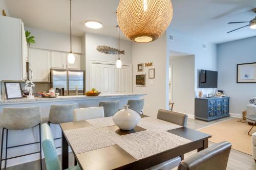 a dining room and kitchen with a table and chairs at Cloud 9 on the Gulf, 1 Mi to Beach Pet Friendly in Bay Saint Louis