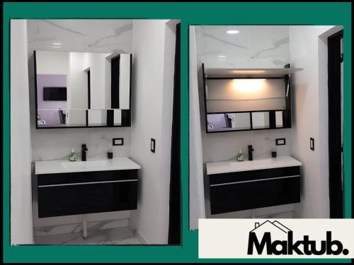 een badkamer met 2 wastafels en een spiegel bij Maktub Alojamiento in San Antonio Oeste