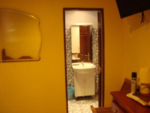 a bathroom with a sink and a mirror at TSANKARA in Oiapoque