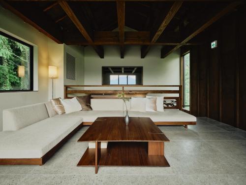 a living room with a couch and a coffee table at THE[]TIME FUJI - Vacation STAY 81405v in Oishi