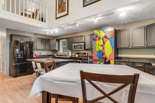 a kitchen with a table and chairs in it at Relax at Saddleback in Mill Spring