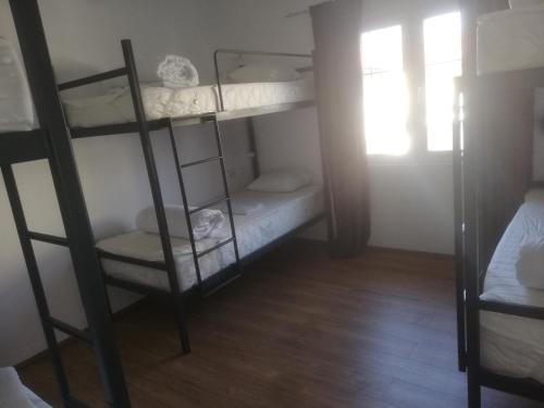 a room with two bunk beds and a window at Hostel Vintage in Ohrid