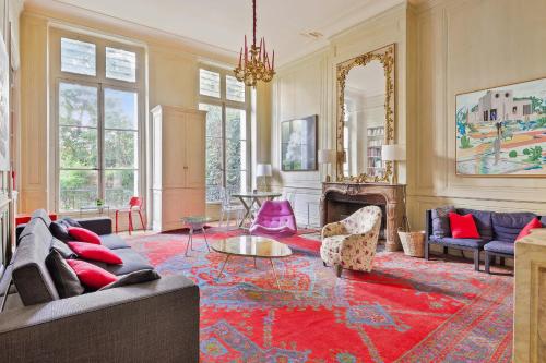 a living room with a couch and a table at Splendid appartment in the heart of Paris - Welkeys in Paris