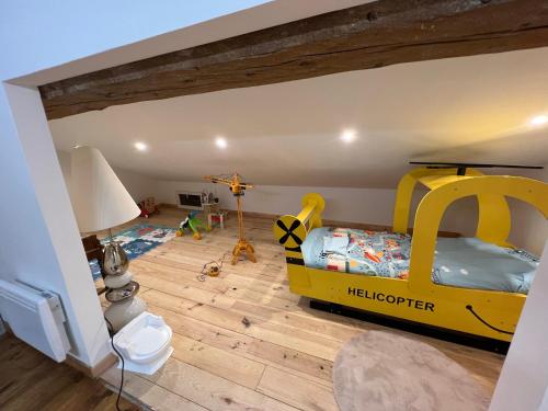 a childs room with a bed in a lego house at Jolie maison en pierre esprit chalet avec Jacuzzi in Serdinya