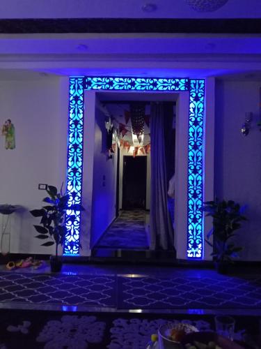 a hallway with blue lights in a room at Pyramids sunrise in Cairo