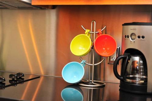 a group of pots and pans on top of a stove at Yonge Suites Apart Hotel in Toronto