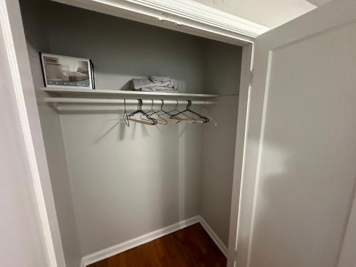 a hallway with a shelf with glasses on it at Charming 1930s Style Rustic Home in Eugene