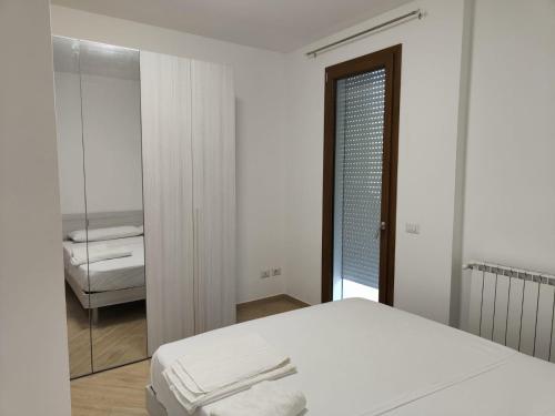 Ένα ή περισσότερα κρεβάτια σε δωμάτιο στο Villa A&M 8 - OSPEDALE GORETTI