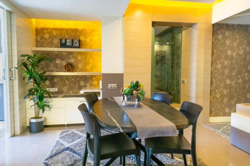 a dining room with a table and chairs at Downtown Oasis - Spacious Modern 3-BR Flat near Beachpark in Antalya