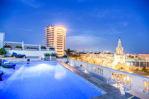 a pool on the roof of a building at night at NH Royal Urban Cartagena in Cartagena de Indias