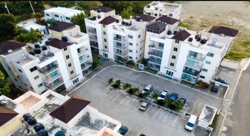 an overhead view of a large parking lot with white buildings at You deserve a comfortable stay! in Santiago de los Caballeros