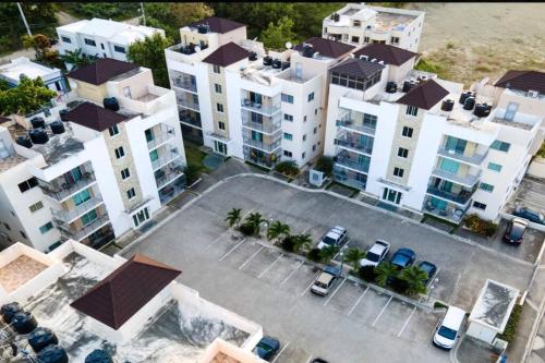 an overhead view of a large parking lot with buildings at You deserve a comfortable stay! in Santiago de los Caballeros
