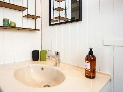 a bathroom sink with a bottle of soap on it at Three-Bedroom Holiday home in Lemvig 6 in Lemvig