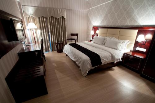 Postelja oz. postelje v sobi nastanitve Pariss Hotel