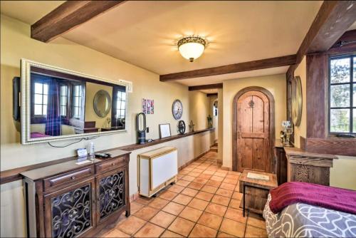 a bedroom with a bed and a mirror and a door at Hacienda - Private Guest Studio in Los Gatos