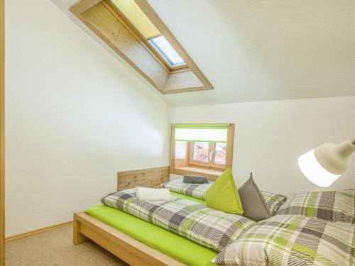 a bedroom with two beds and a window at Troadstadl Windaublick in Westendorf
