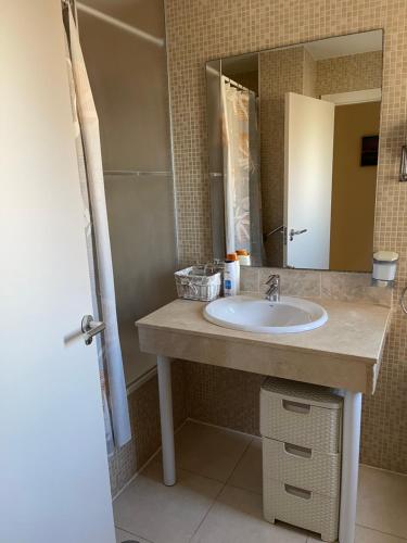 a bathroom with a sink and a mirror at Apartment Bahia del Sol, a 20 m de Playa Arinal-Bol,Calpe in Calpe