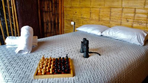 a tray of chessetts on a bed with aedes at HakunaMatata glamping Pumba in Salento