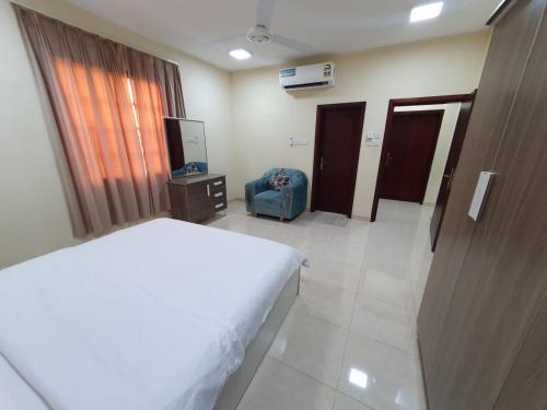 a hotel room with a bed and a television at Terhal salalah 1 in Salalah